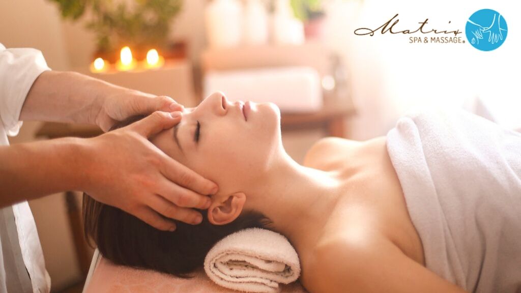 Woman receiving a massage for headaches - Matrix Spa & Massage
